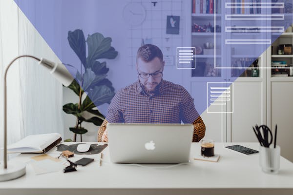 Man in Blue and White Checkered Dress Shirt Using Silver Macbook